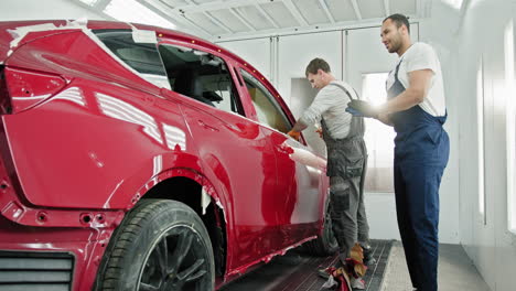 car repair and painting in a paint booth