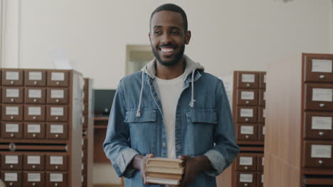 student in library with books