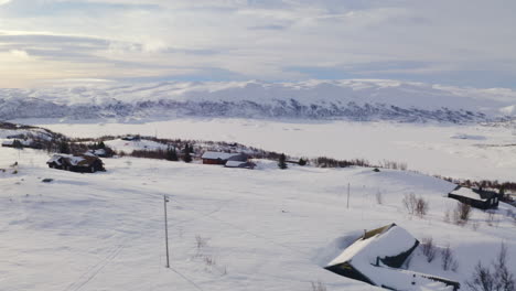 amazing white mountain view in huagastol norway in winter - aerial shot