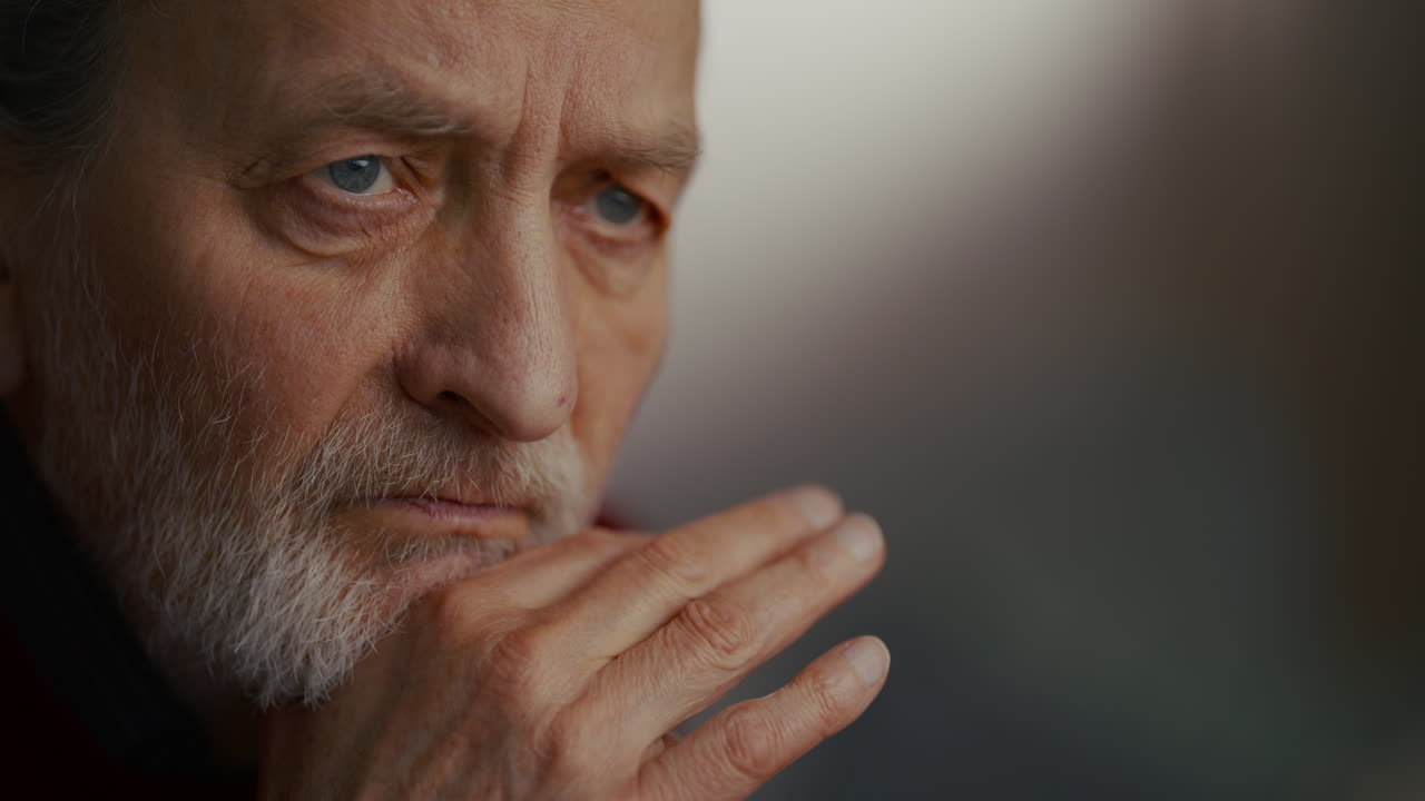 Close-up of Pensive Older Man Deep in Thought