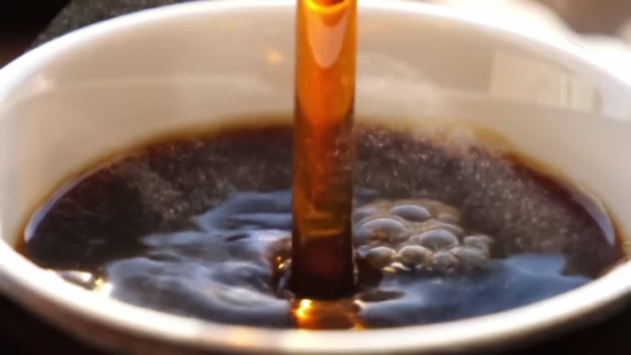 A Seductive Dance of Color and Flavor: Captivating Moments of Rich Coffee Being Enhanced by Golden Honey Drizzling Into a Cup