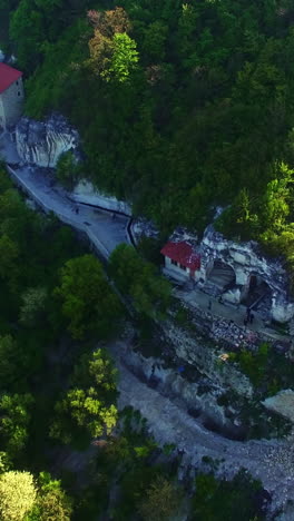 aerial view of a monastery in a mountainous valley