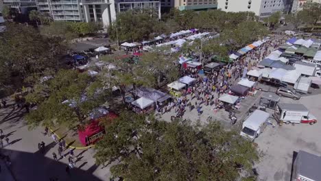 4k aerial drone video of shoppers at farmers market in downtown st