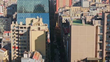 aerial shot along huérfanos street seen from santa lucia hill in santiago, chile