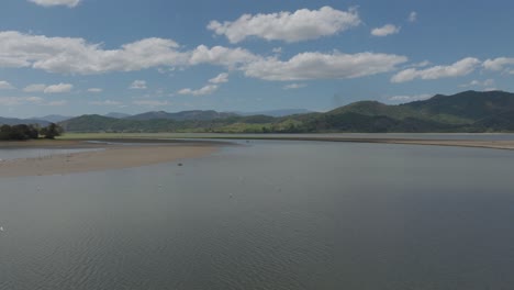 Flying-over-river-water-surface-of-Aniana-Vargas-National-Park-in-Dominican-Republic