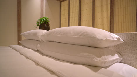 white pillows decoration on bed in luxury hotel resort bedroom