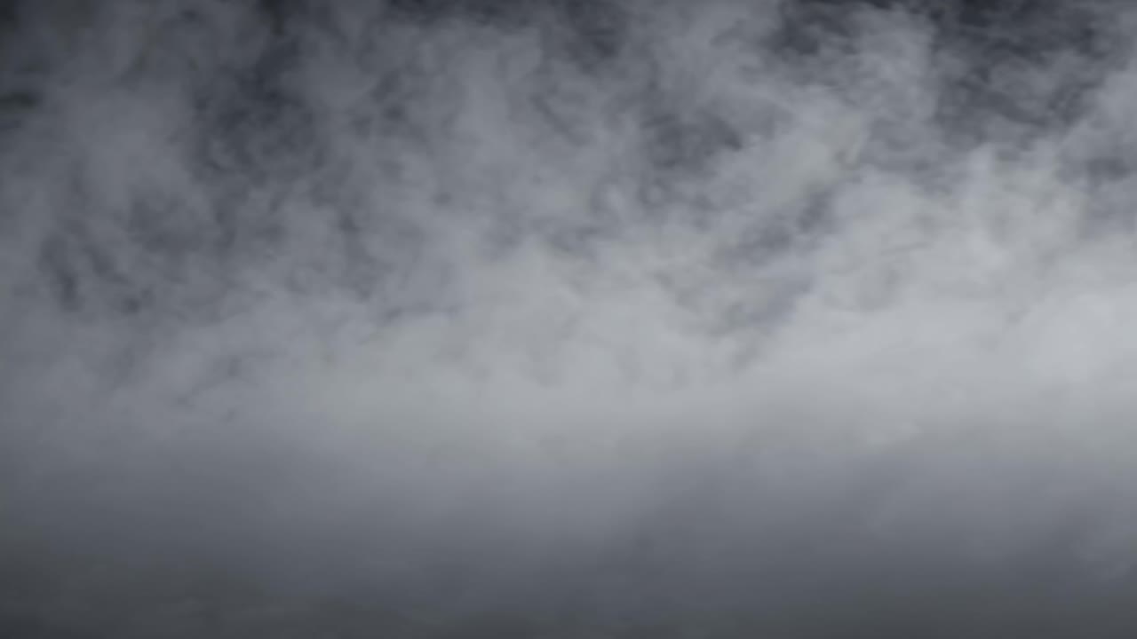 Aerial video captures a dramatic sky filled with dense, swirling clouds, creating a moody