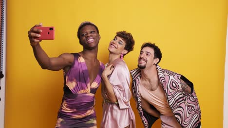multiethnic trans men taking a selfie in a photographic studio