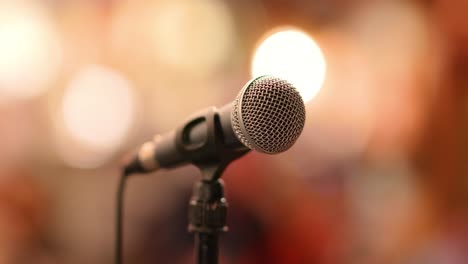 microphone on stage against a background of auditorium.