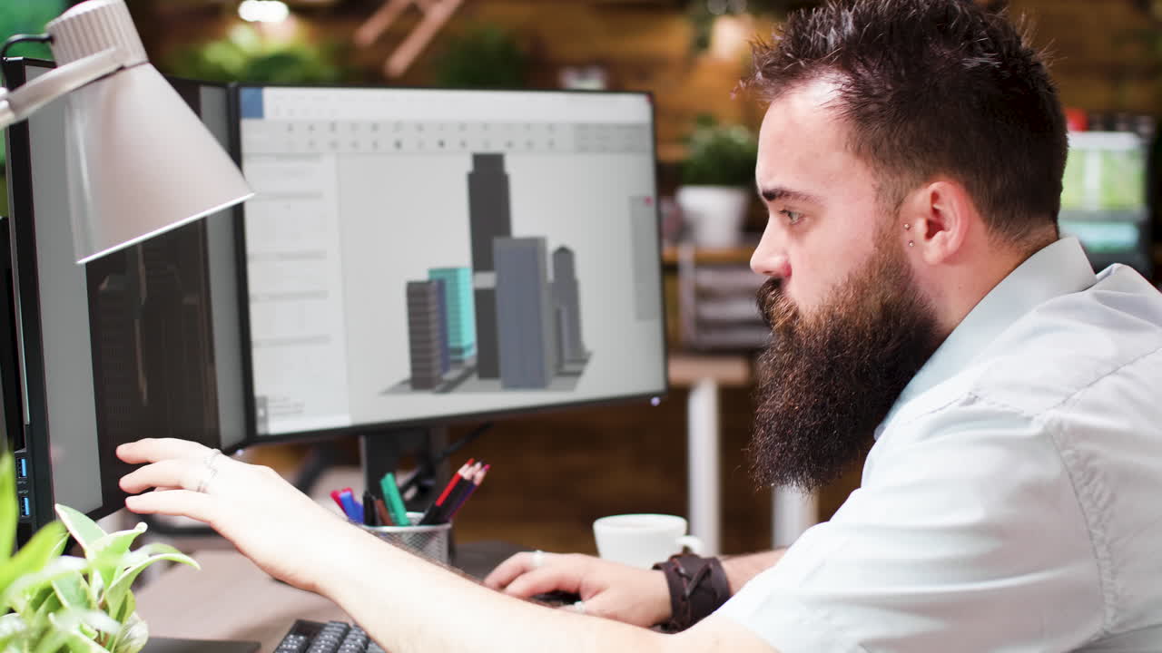 Man working on 3D architecture model on computer