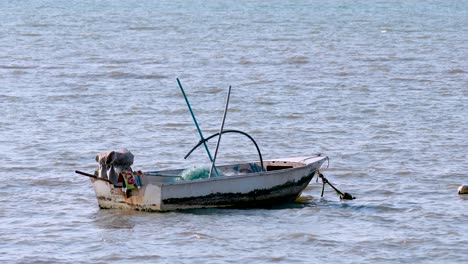 a lone boat floating on pattaya's calm sea