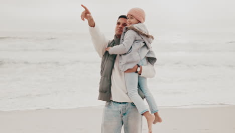 padre e hija en la playa