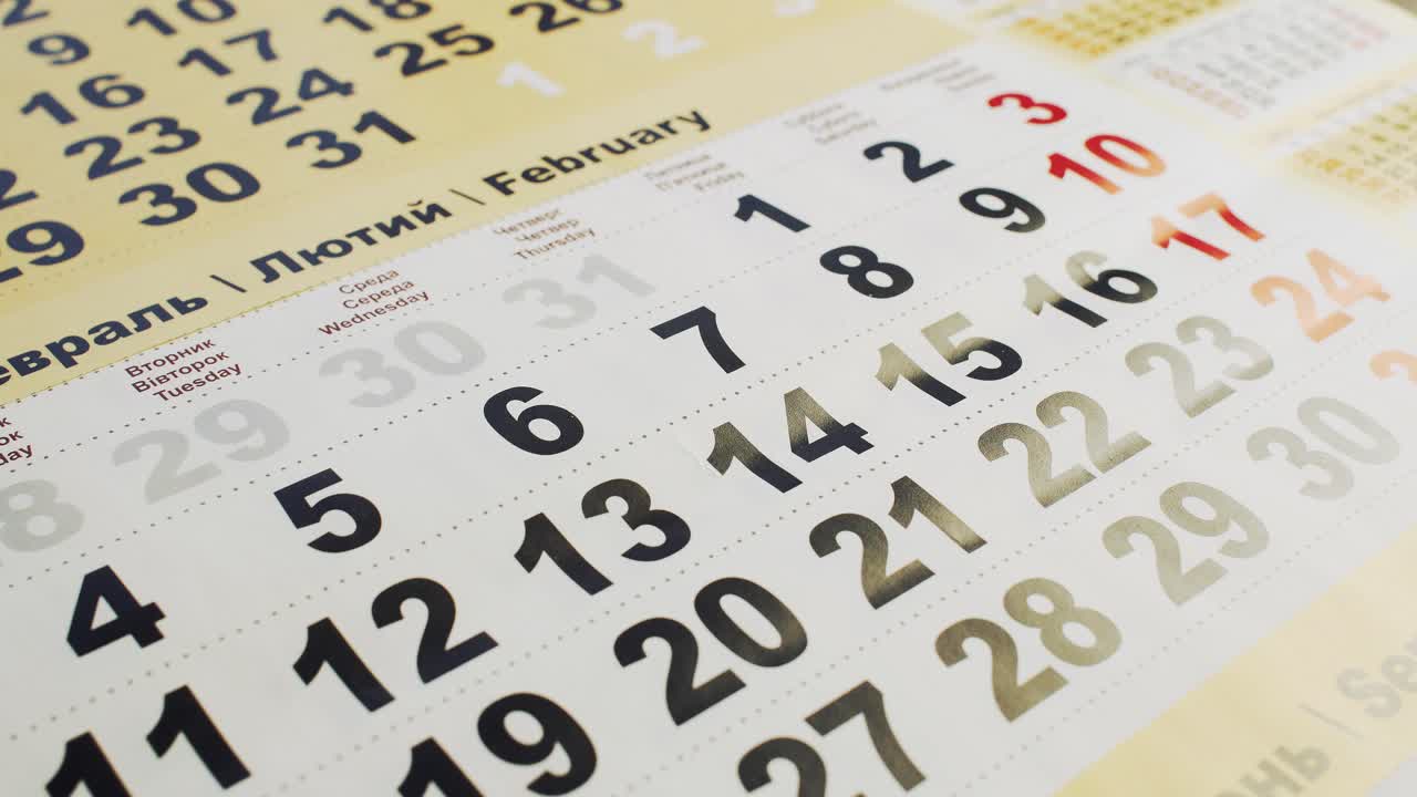 Black paper heart covers number 14 in February on the calendar. Valentine's day, love and broken heart