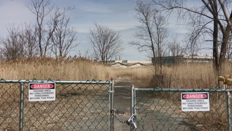 signs on fence indicates danger hazards area