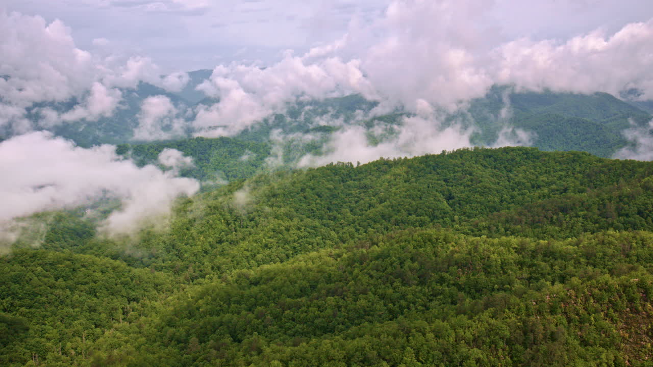 Cinematic drone shot of fog drifting over the Smokies.