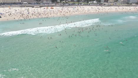 Tourist-Sunbathing-And-Swimming-At-Bondi-Beach-In-Summer---Sydney,-NSW,-Australia
