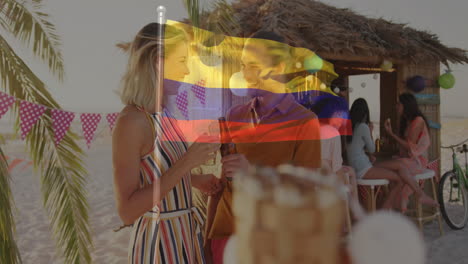 at beach party, two people drinking with colombian flag animation overlay