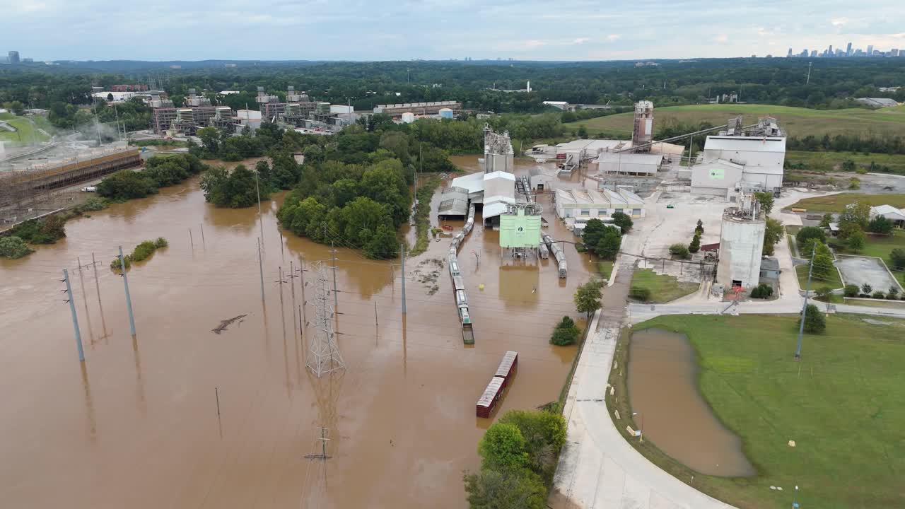 Drone shot pushing in on the Chattahoochee River flooding from Hurricane Helene in Atlanta, Georgia.