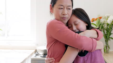 happy, love and asian mother hugging her child