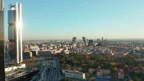 Forwards-fly-around-skyscrapers-in-business-hub.-Aerial-view-of-cityscape-with-Gate-of-Europe-twin-towers.