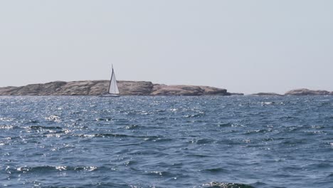 a sailing boat out to sea during summer in bohuslan, sweden