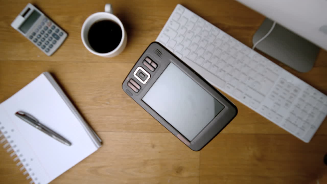 Smartphone falling onto office desk