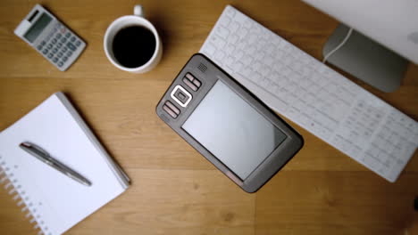 Smartphone-falling-onto-office-desk