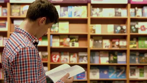 student reading book in library