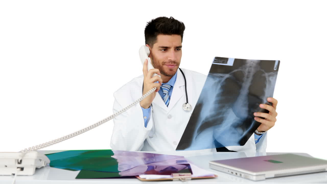 Young doctor working at his desk