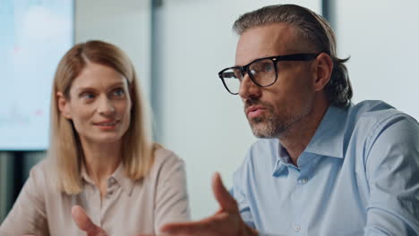 professional man talking colleagues office. business couple presenting project