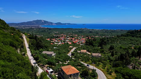 aerial panoramic at agios sostis greek village landscape sea mountain background beautiful location, homes of mediterranean touristic spot