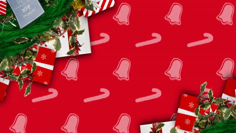 animation of christmas decorations and bells and candy canes pattern on red background