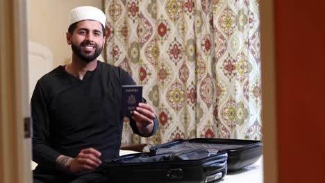 middle eastern man with passport travel track left