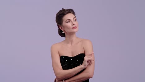 elegant woman in black dress posing and expressing different emotions
