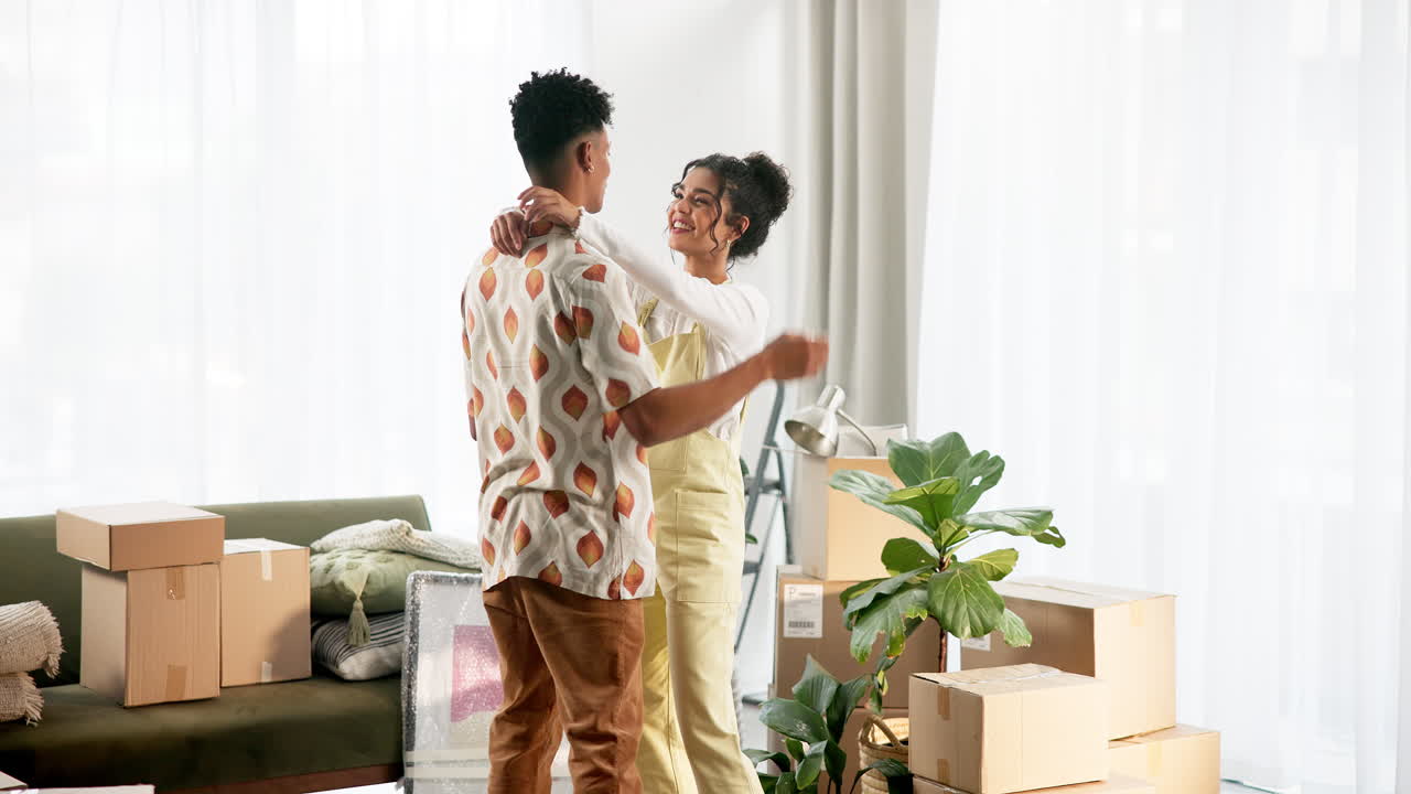 Couple celebrating moving into a new home