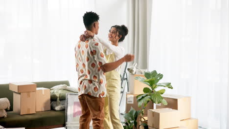 couple celebrating moving into a new home