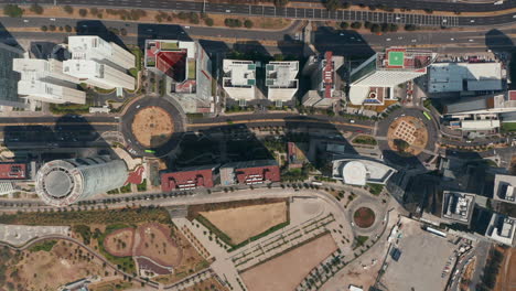 Aerial-birds-eye-overhead-top-down-panning-view-of-two-rows-of-tall-buildings-in-Santa-Fe.-Street-leading-between-skyscrapers.-Mexico-City,-Mexico.