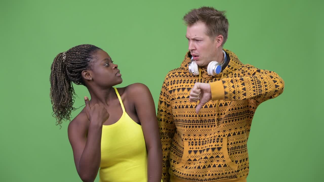 Young multi-ethnic couple having different decisions