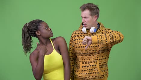 young multi-ethnic couple having different decisions