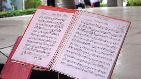 hand-held shot of mexican sheet music at the guelaguetza event