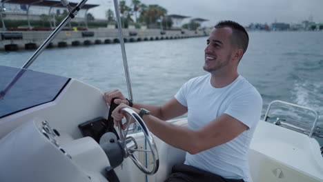 smiling man enjoying a boat ride on the water