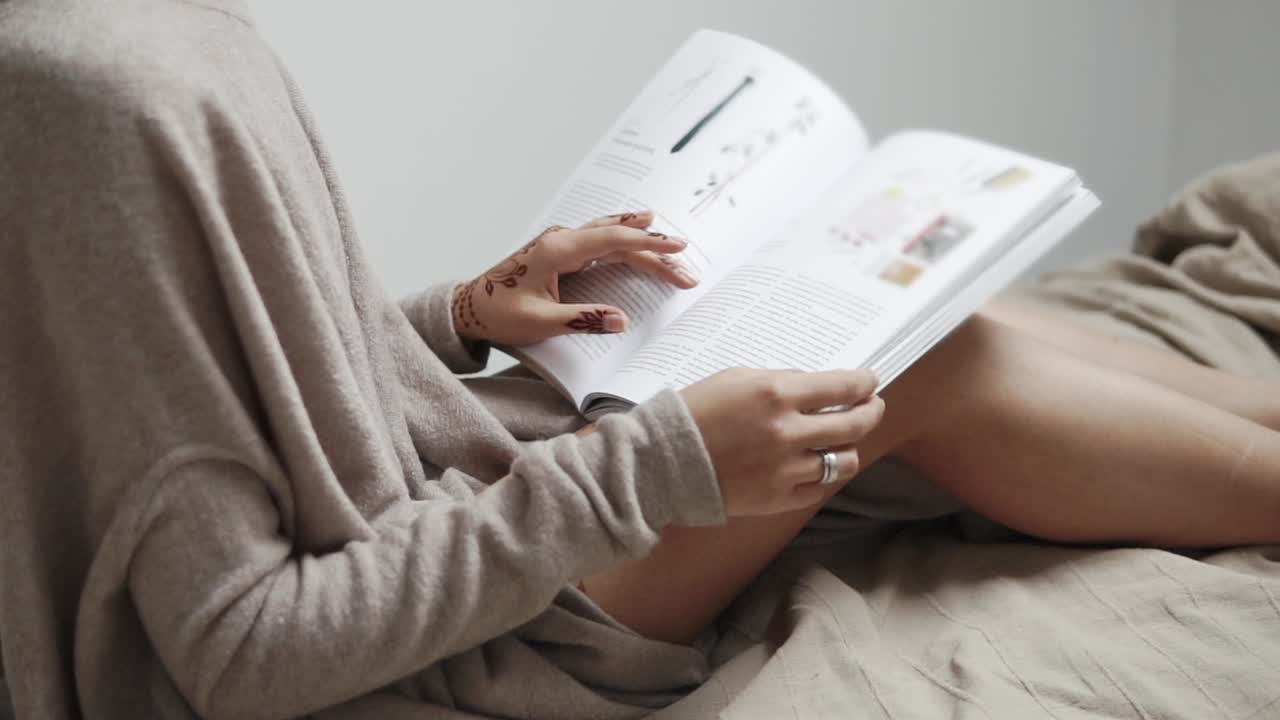 Woman Reading a Magazine in Bed