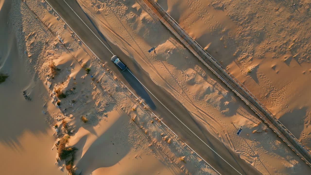 Drone view desert highway running along sandy terrain summer. Transport riding