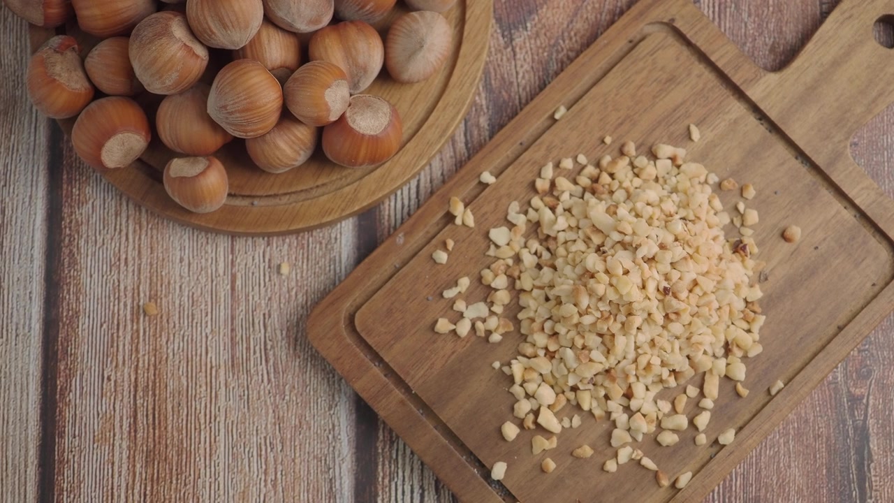 Chopped Hazelnuts on a Wooden Cutting Board