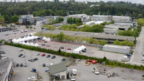 queue of cars in a drive-thru covid-19 vaccine site in canada