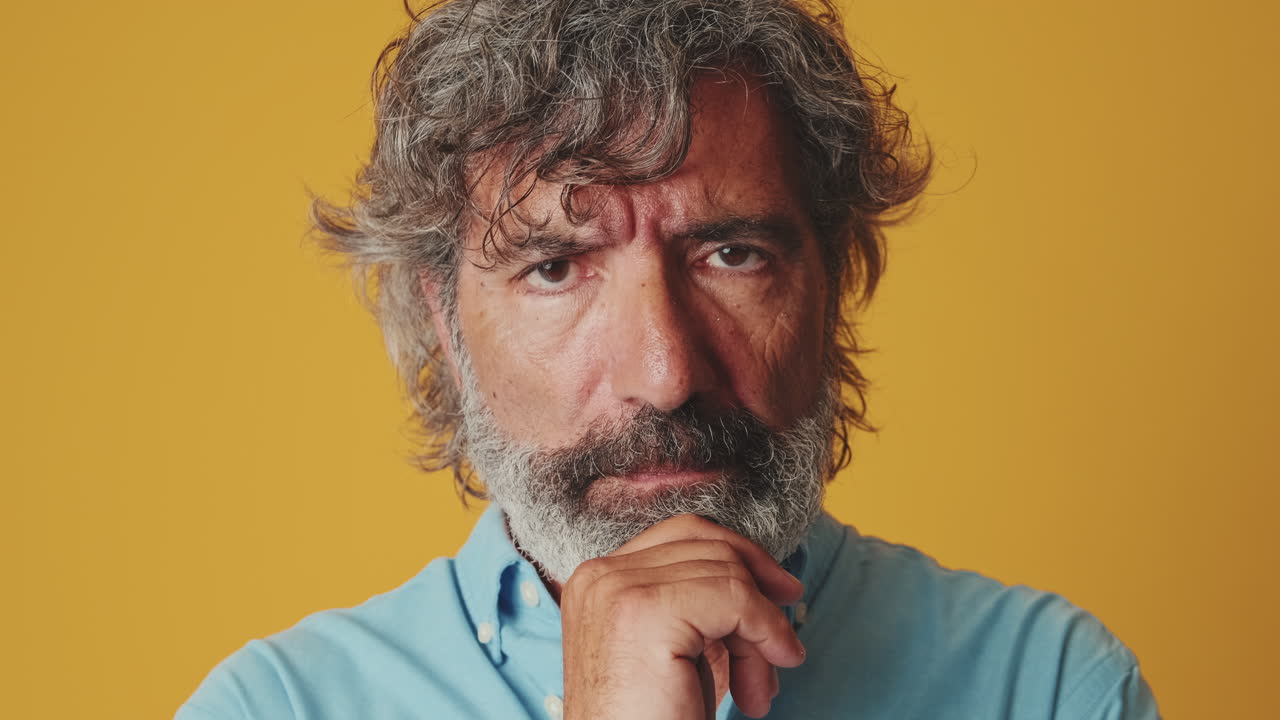 Close-up of Pensive Mature Man Thinking Deeply