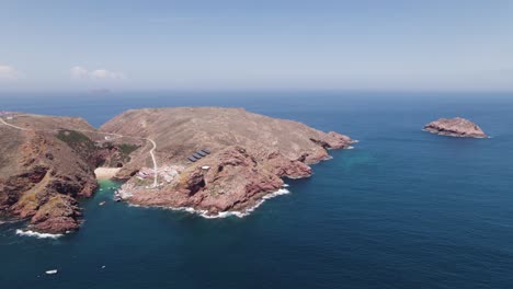 Berlenga-Grande-island-aerial-view-with-Esposende-lighthouse-and-scenic-beach-cove-landmarks,-Portugal