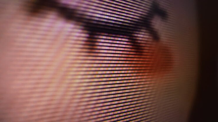 playing cartoon on LCD screen of TV with glowing pixels