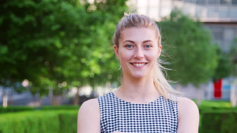 portrait of businesswoman walking through city on way to work