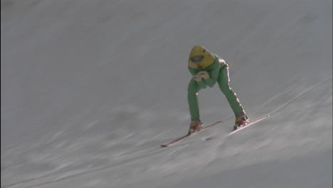 a skier races down a slope